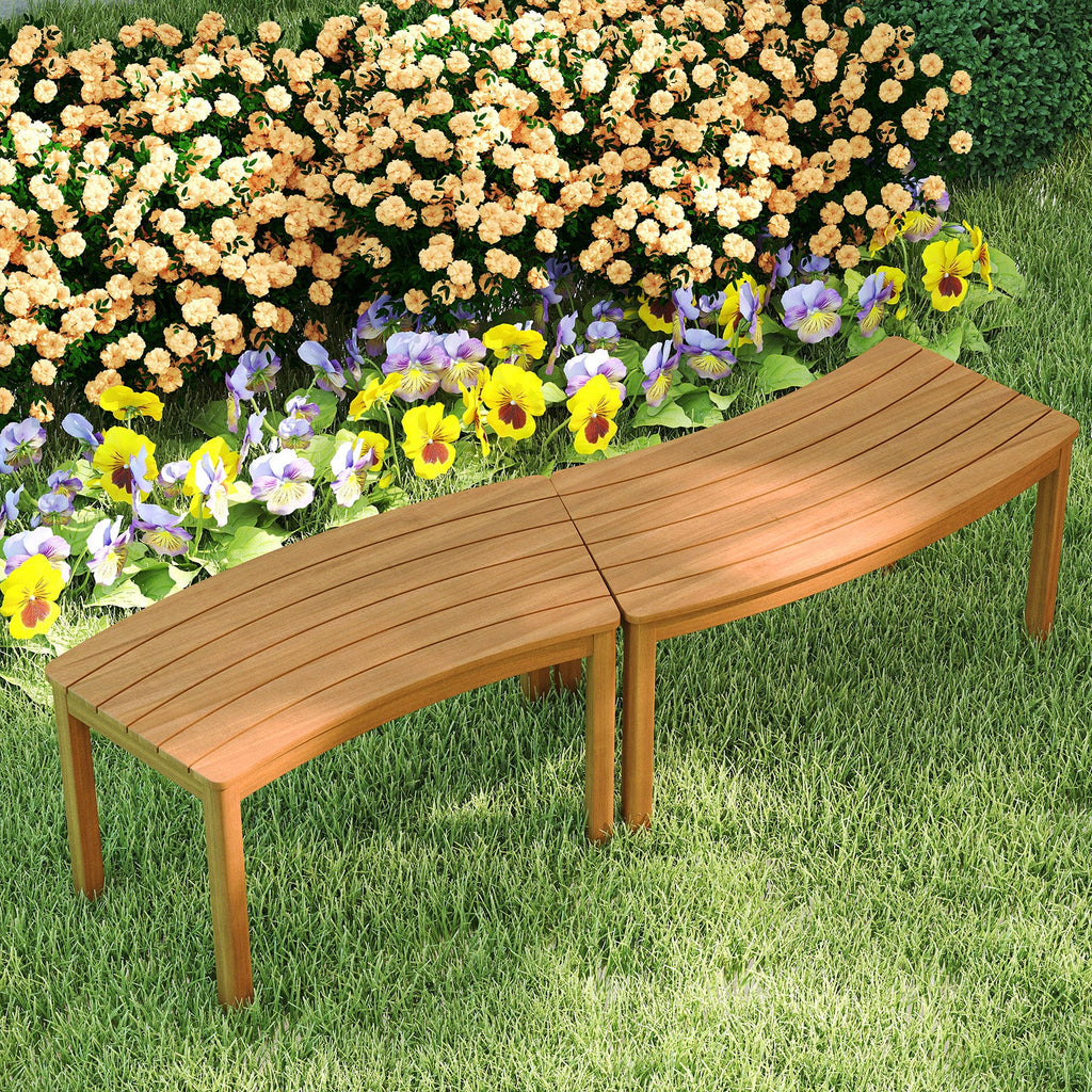 Curved acacia wood outdoor bench with slatted tabletop top and tapered legs