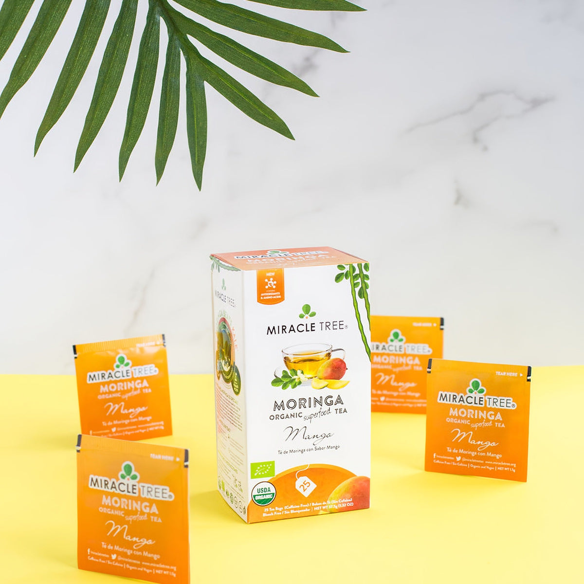 Miracle Tree organic moringa mango tea box with matching tea bag packets