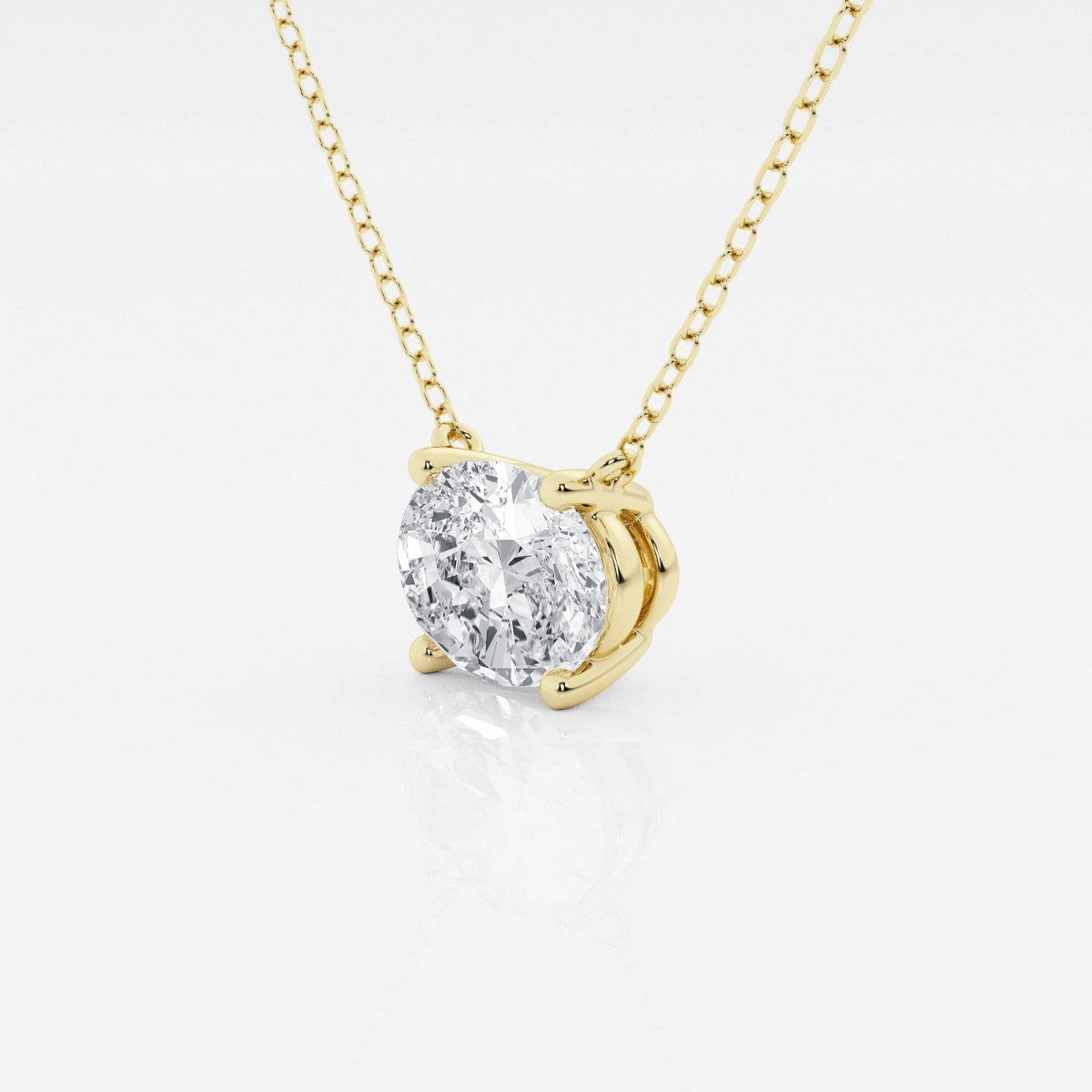 Oval lab-grown diamond solitaire pendant on yellow gold chain, side view prongs