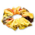 Tie-dye ribbed scrunchie in yellow, orange, tan, and brown