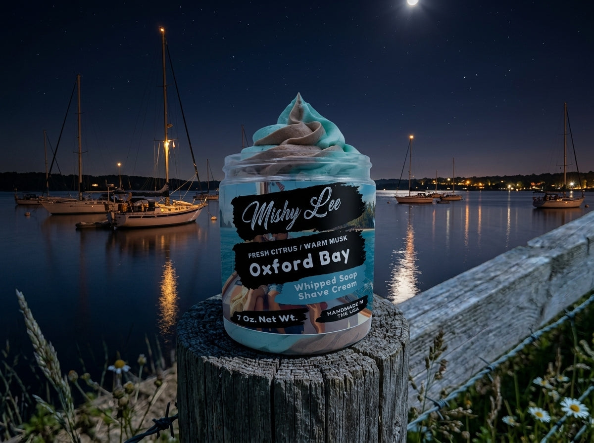 Whipped soap shave cream jar on dock at night with teal and tan swirls; Oxford Bay label