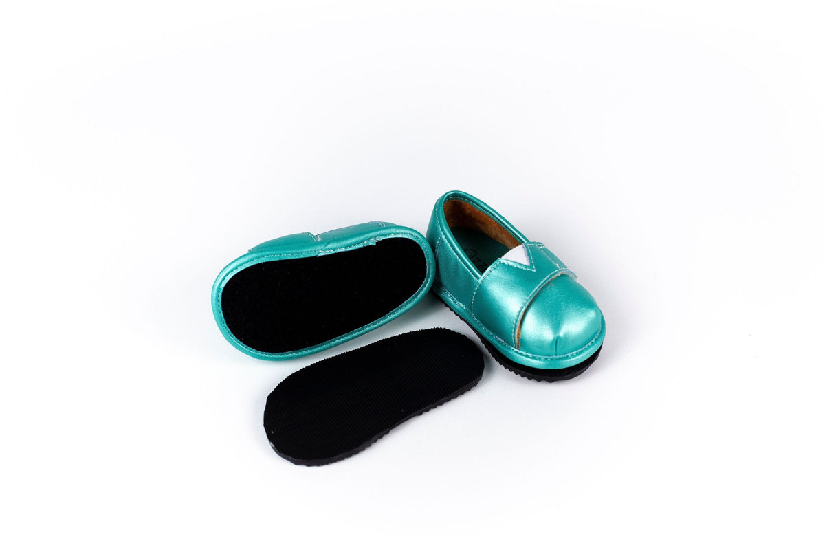 Teal slip-on barefoot shoe with open lining and black insoles, angled view