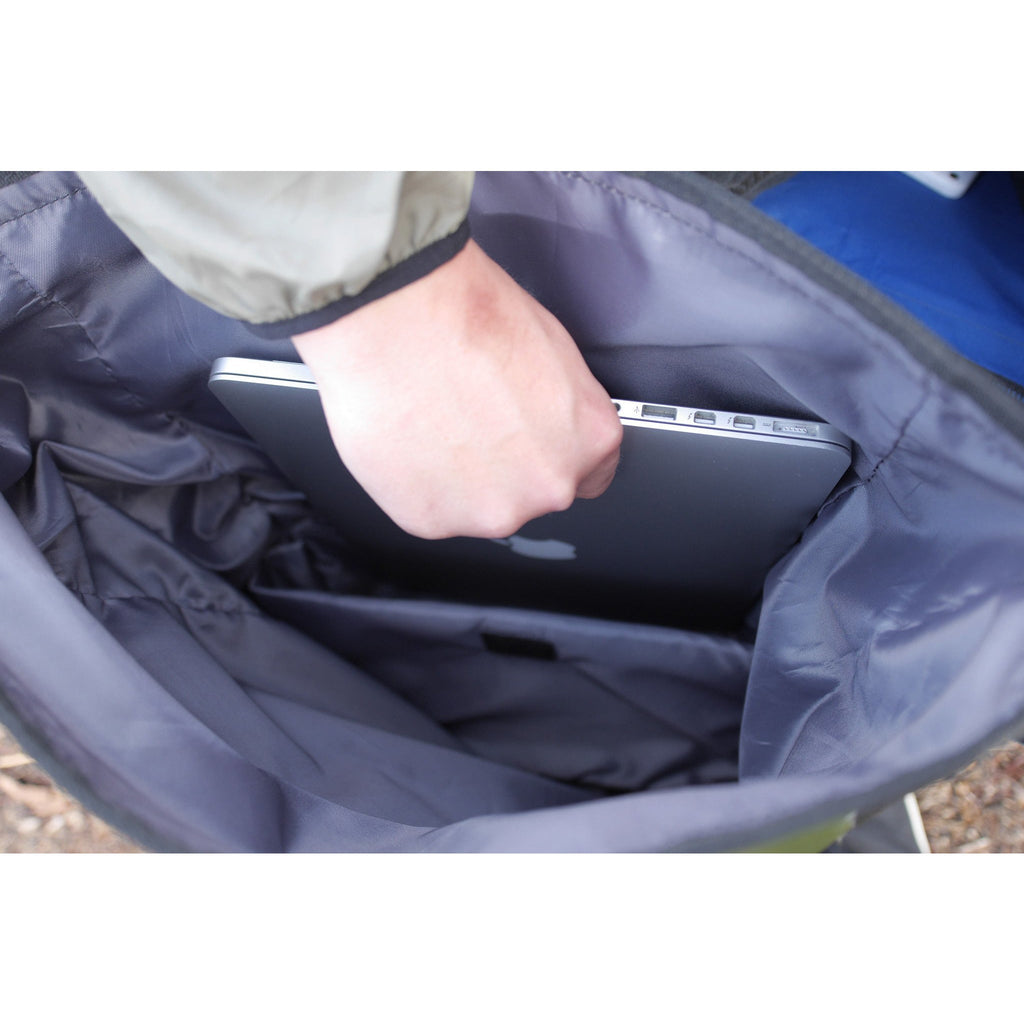 Opened waterproof dry bag backpack interior with padded lining and inner storage pocket