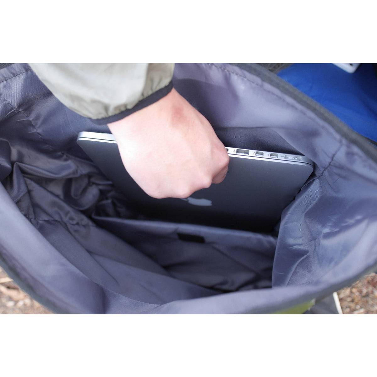 Opened waterproof dry bag backpack interior with padded lining and inner storage pocket