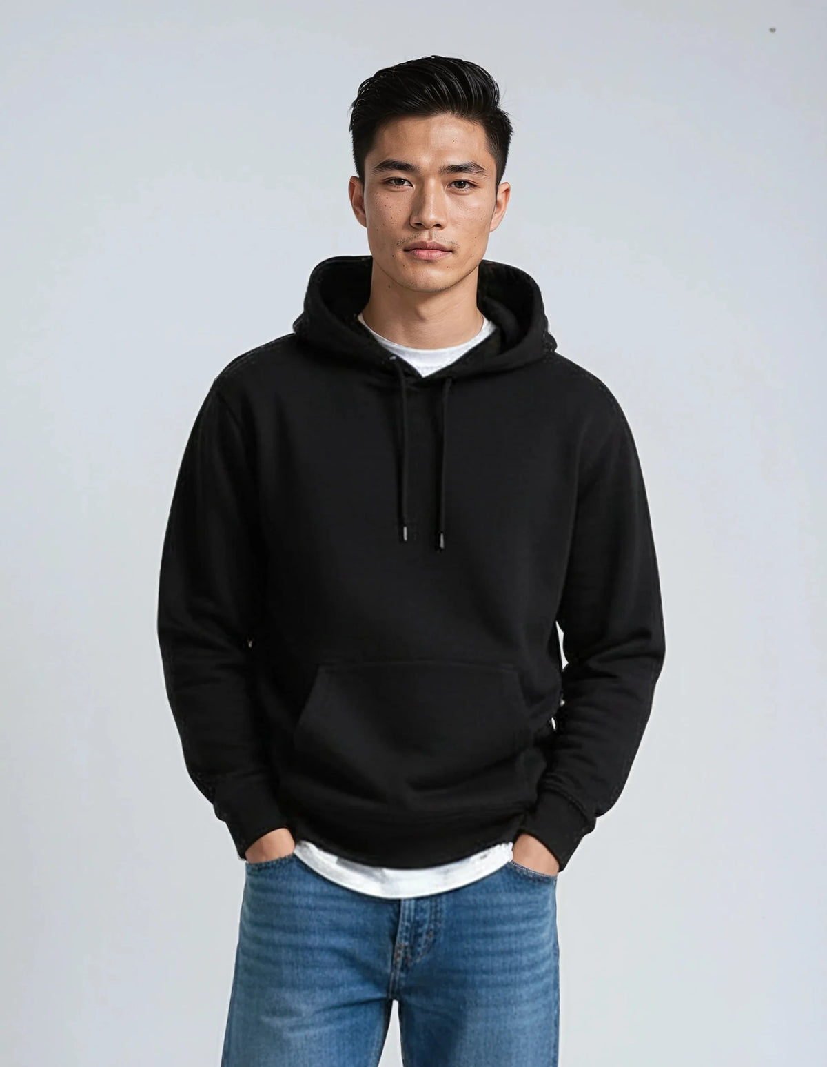 Black heavyweight pullover hoodie with drawstring hood and front kangaroo pocket