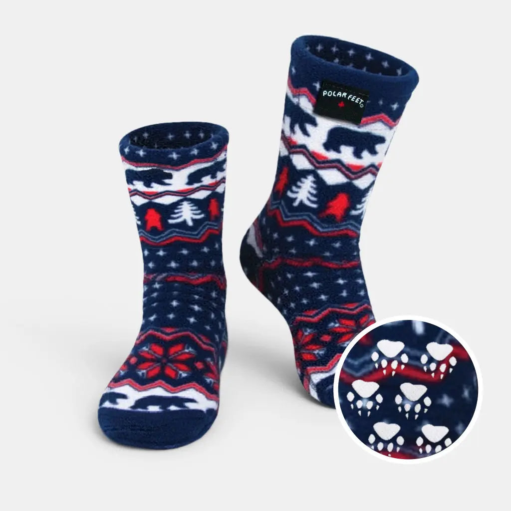 Navy crew socks with polar bear and pine tree design, plus red bow pattern on foot