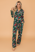 Green holiday pajama set with button-up top and matching pajama pants, full-length sleeves