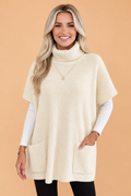 Cream short-sleeve tunic sweater with turtleneck and front patch pockets