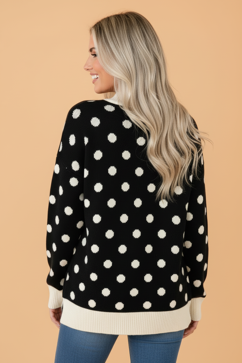 Black polka-dot tunic sweater back view with ribbed cuffs and hem