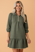 Jungle green textured mini dress with quarter-zip collar and 3/4 sleeves, tiered hem