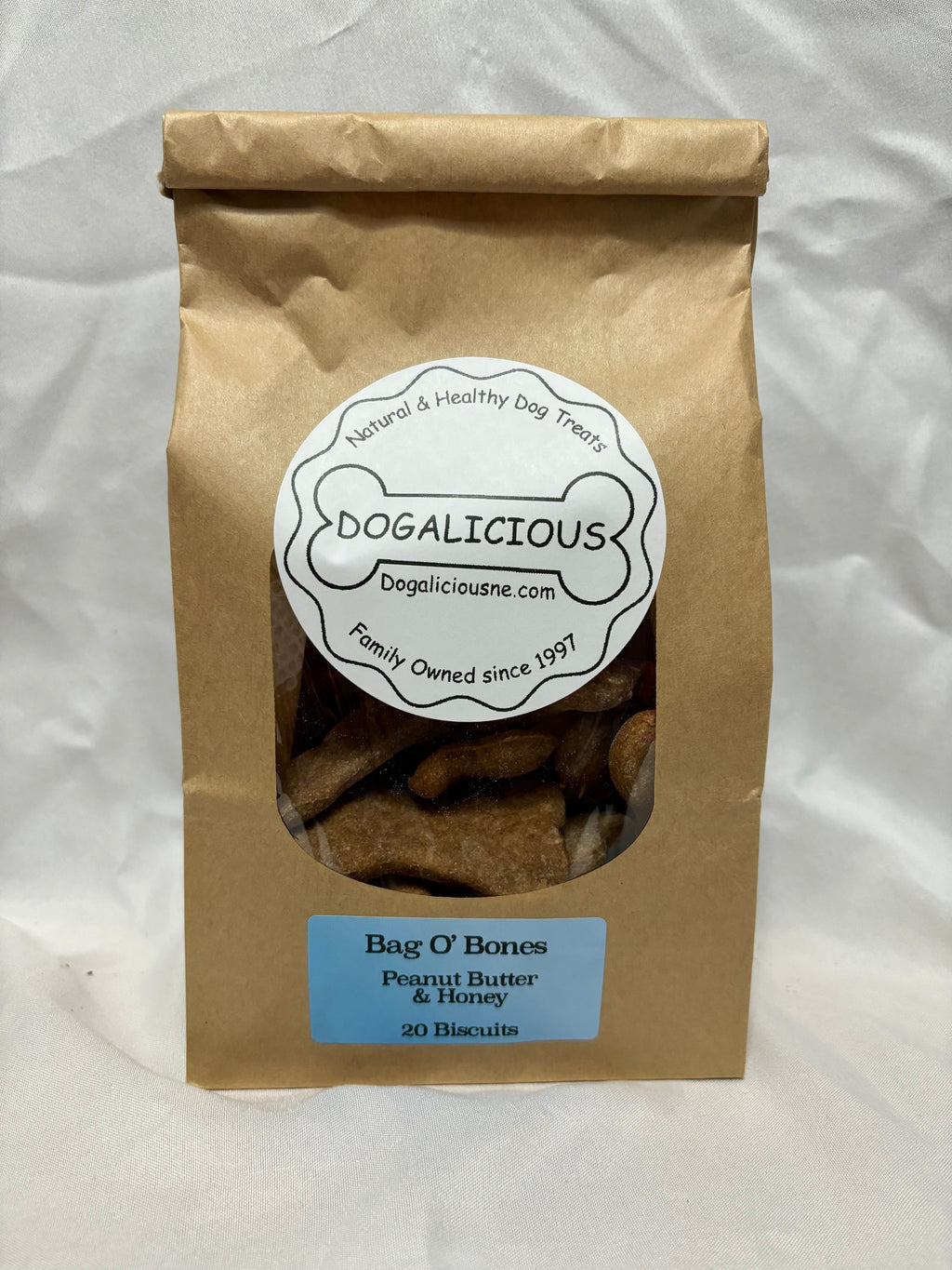 Paper bag of peanut butter and honey dog biscuits