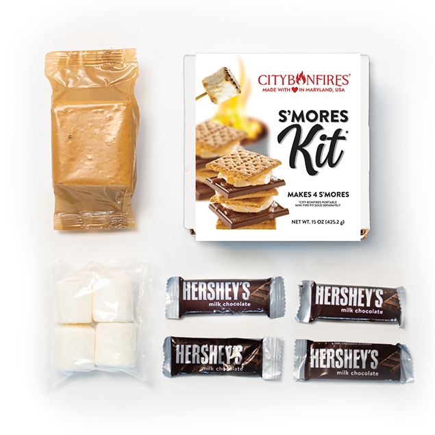 S'mores kit flat lay with graham crackers, marshmallows, and chocolate bars