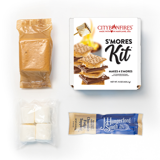 S'mores kit flat lay with graham crackers, marshmallows, and chocolate bars