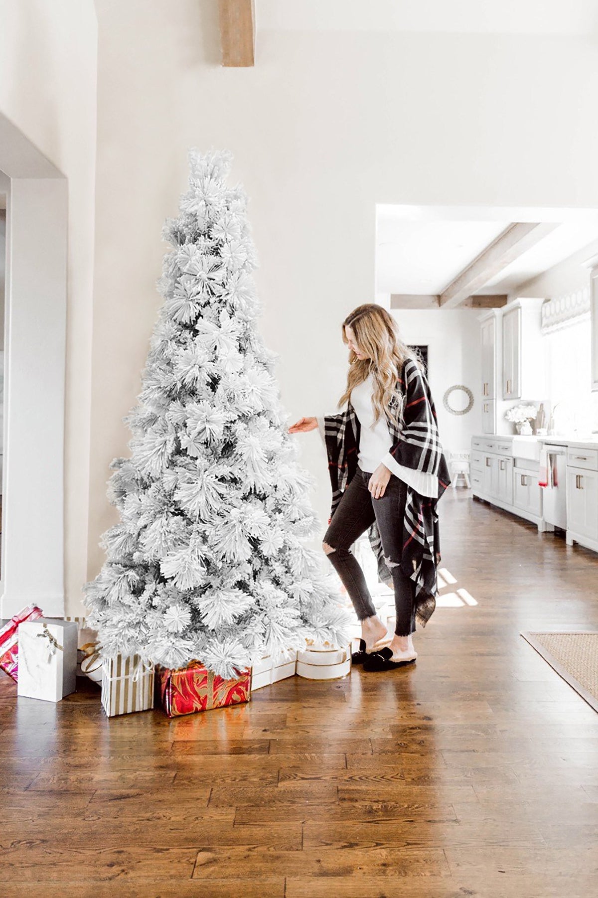 7.5-ft slim snow-flocked artificial Christmas tree with metal stand