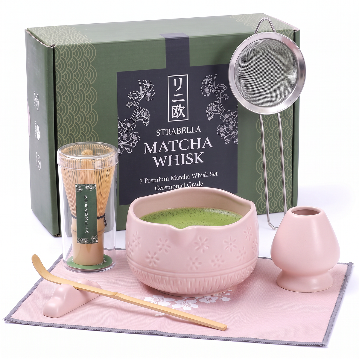 Matcha whisk set with pink ceramic chawan, bamboo whisk, and metal whisk holder
