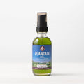 Plantain oil skincare bottle with black pump and green glass