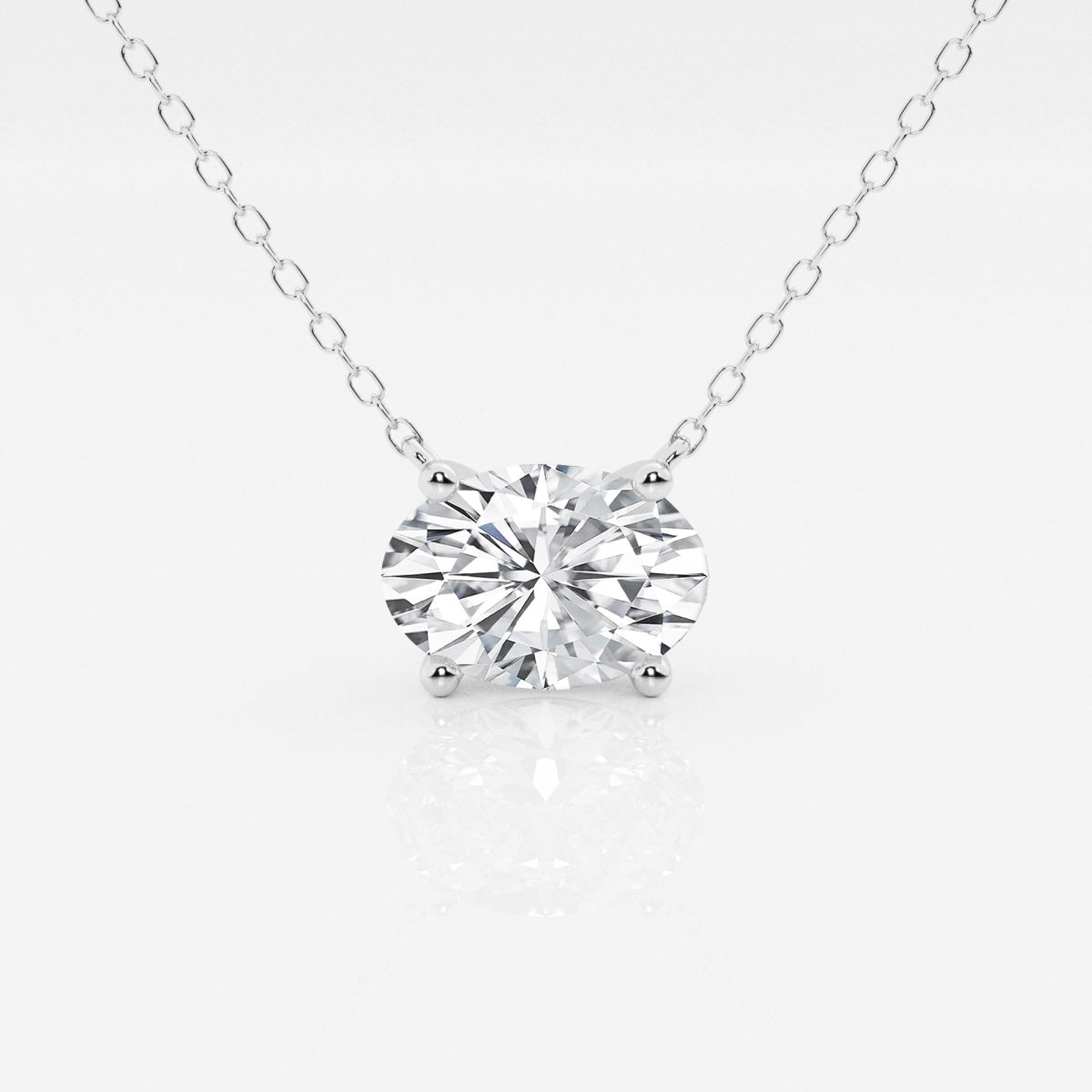 Oval lab-grown diamond solitaire pendant on silver-tone chain, prong-set