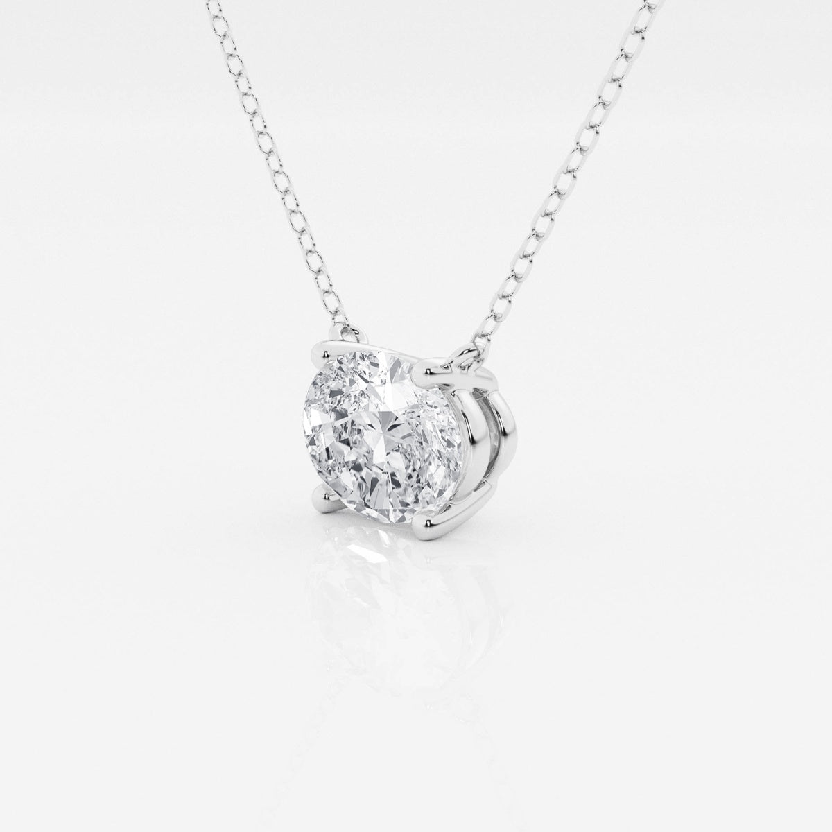 Oval lab-grown diamond solitaire pendant on silver-tone chain, rounded prong setting