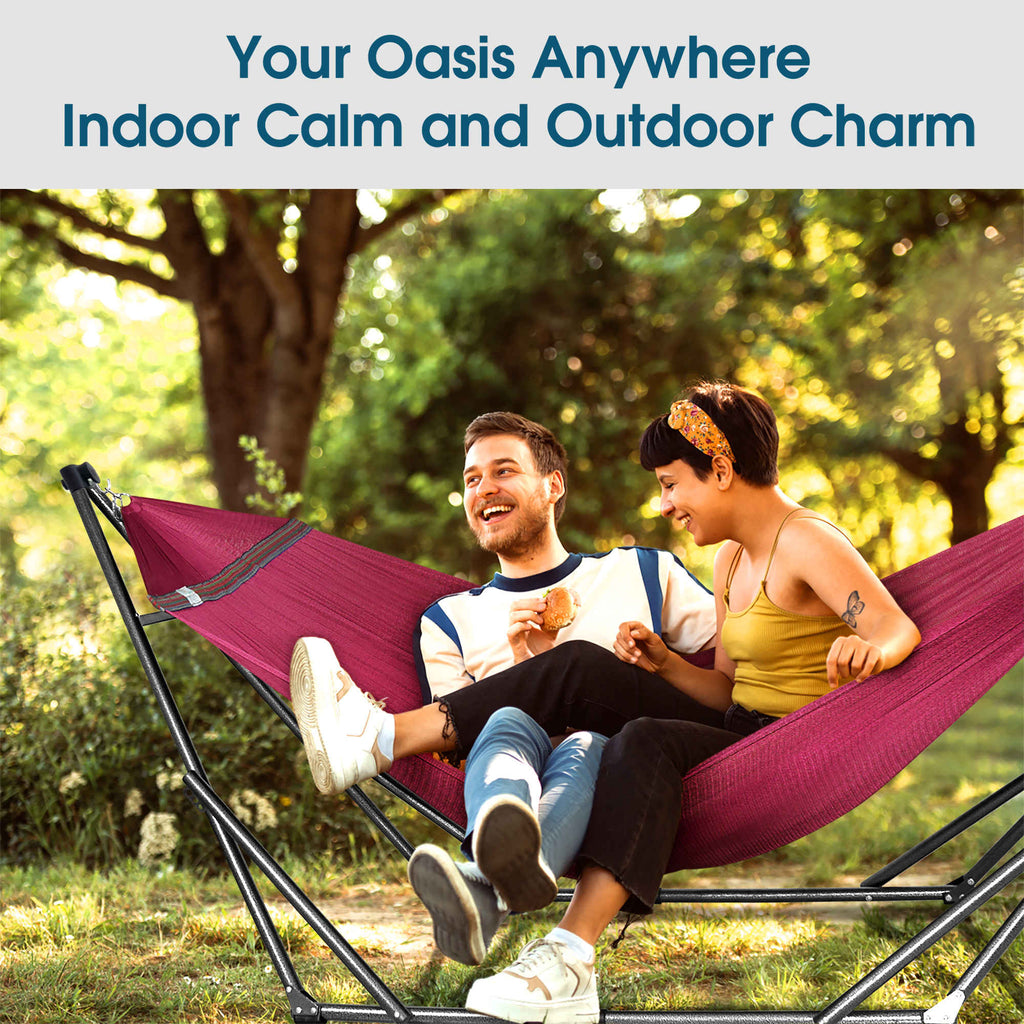 Purple hammock on a stand with two people relaxing outdoors