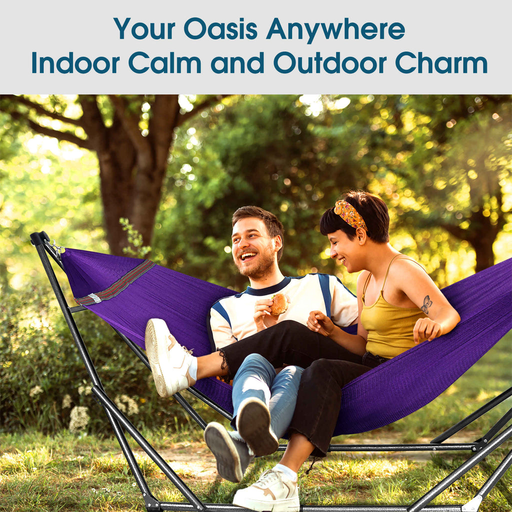 Purple hammock on a stand with two people lounging outdoors