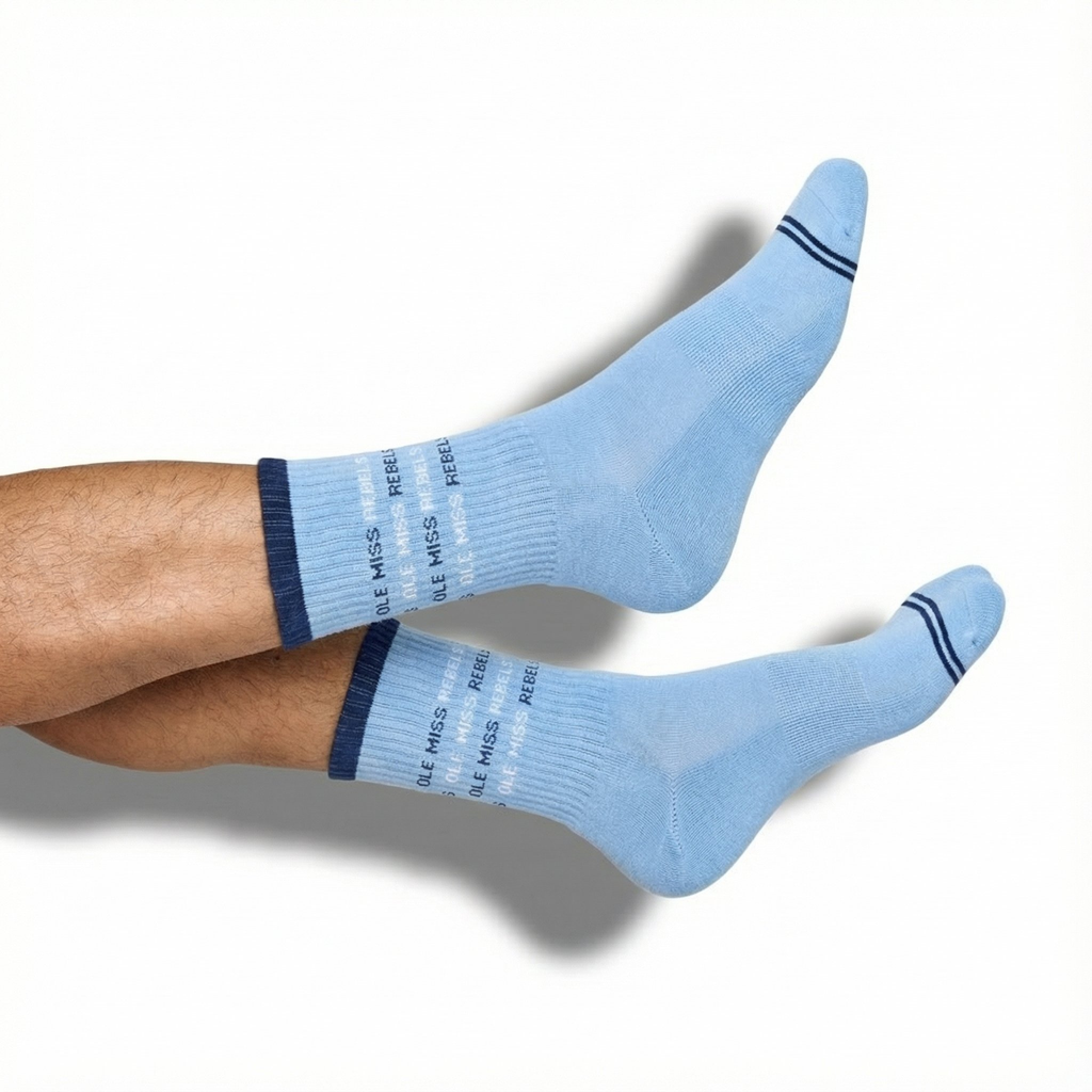 Light blue crew socks with Ole Miss text repeating around the leg