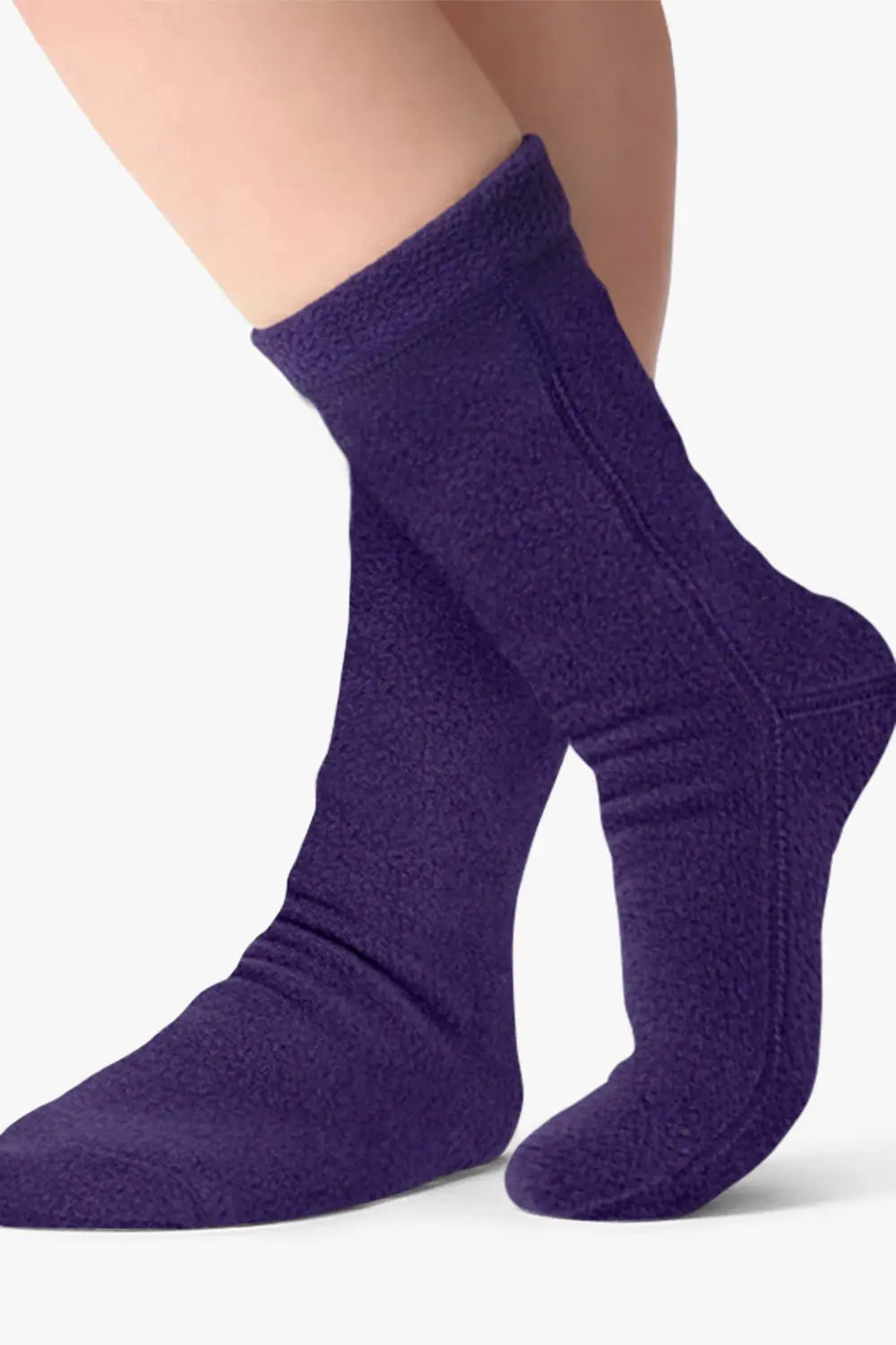 Purple fleece crew socks on feet, ribbed cuffs and stitched heel seam