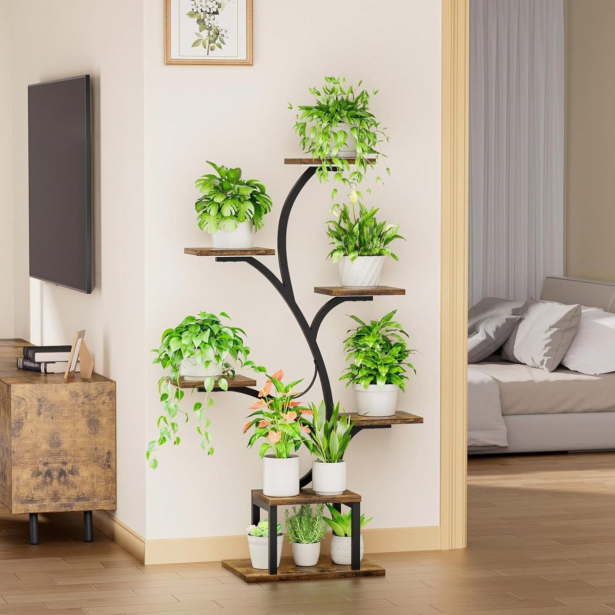 Indoor plant stand with curved black metal frame and potted plants on wooden shelves