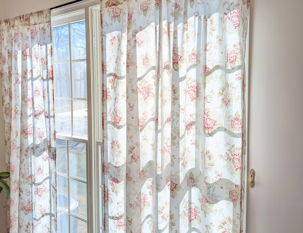Sheer floral curtain panel with vertical pleats, cream fabric and pink rose print