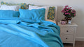 Turquoise teal quilted bedspread with gentle wave stitch pattern; includes pillow shams