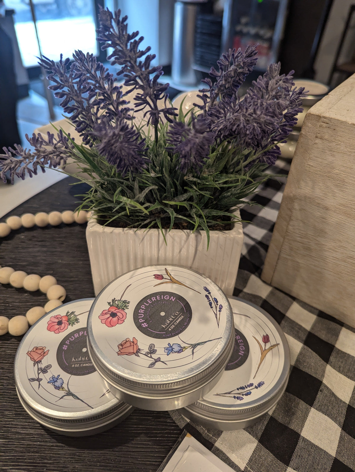 Set of three travel tin candles with floral lids, round silver tins