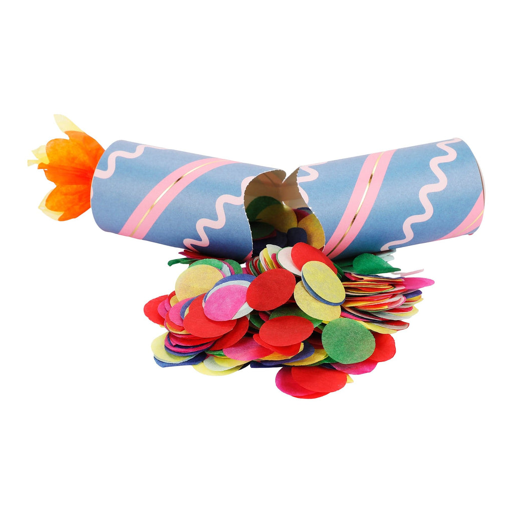 Birthday party cracker with blue and pink striped tube and orange paper flame tassel