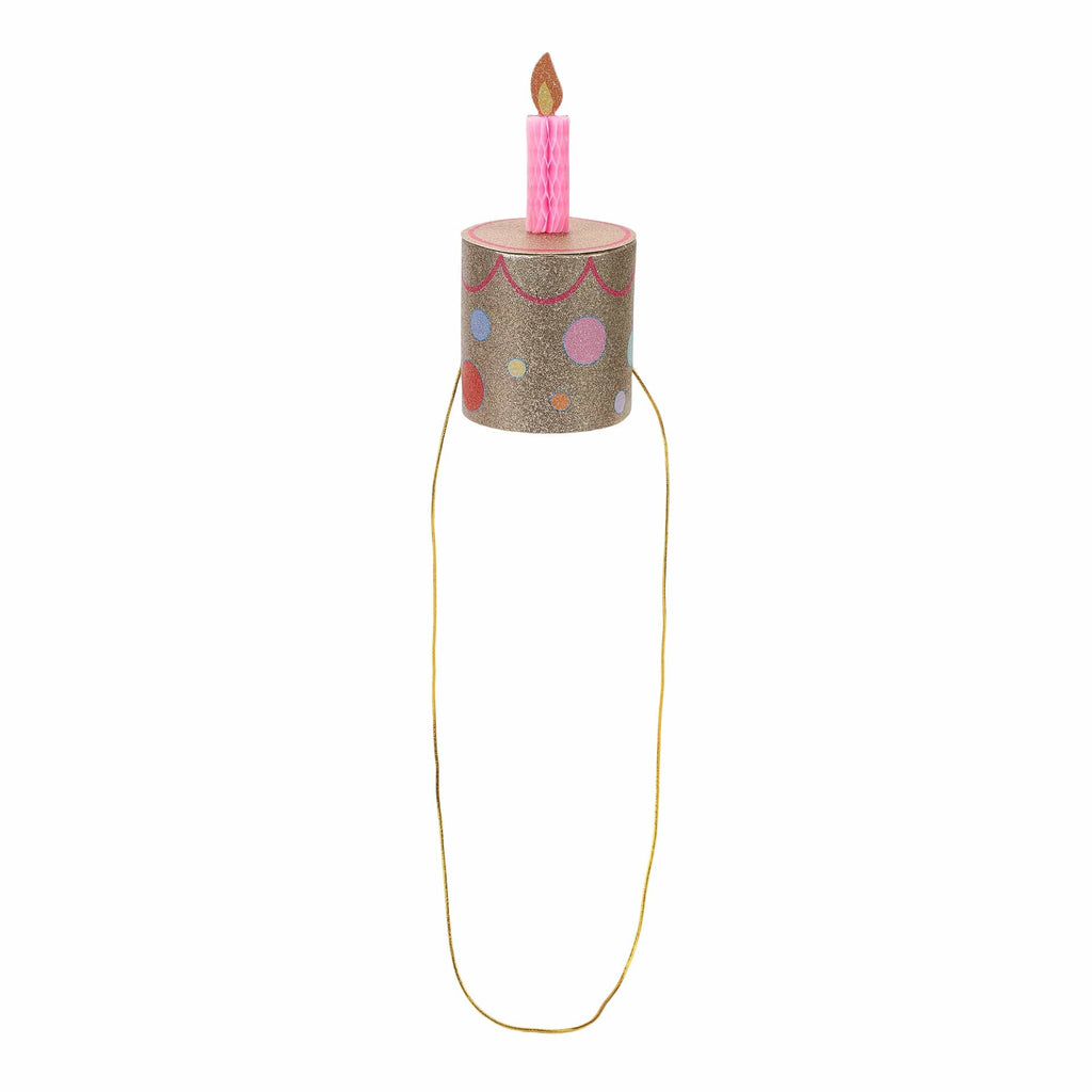 Gold glitter cake party hat with pink candle and long gold tie cords