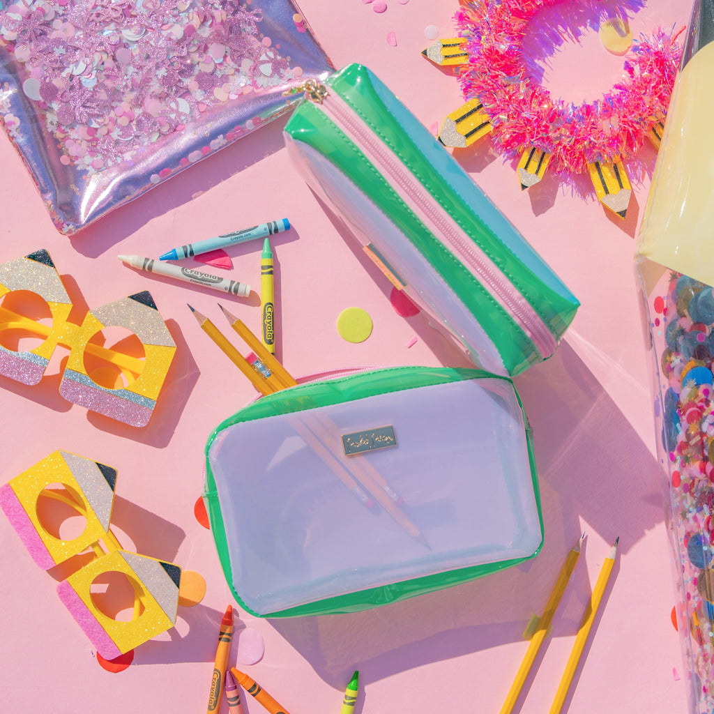 Colorblock jelly pouch set with clear panels, green sides, and pink zipper accents