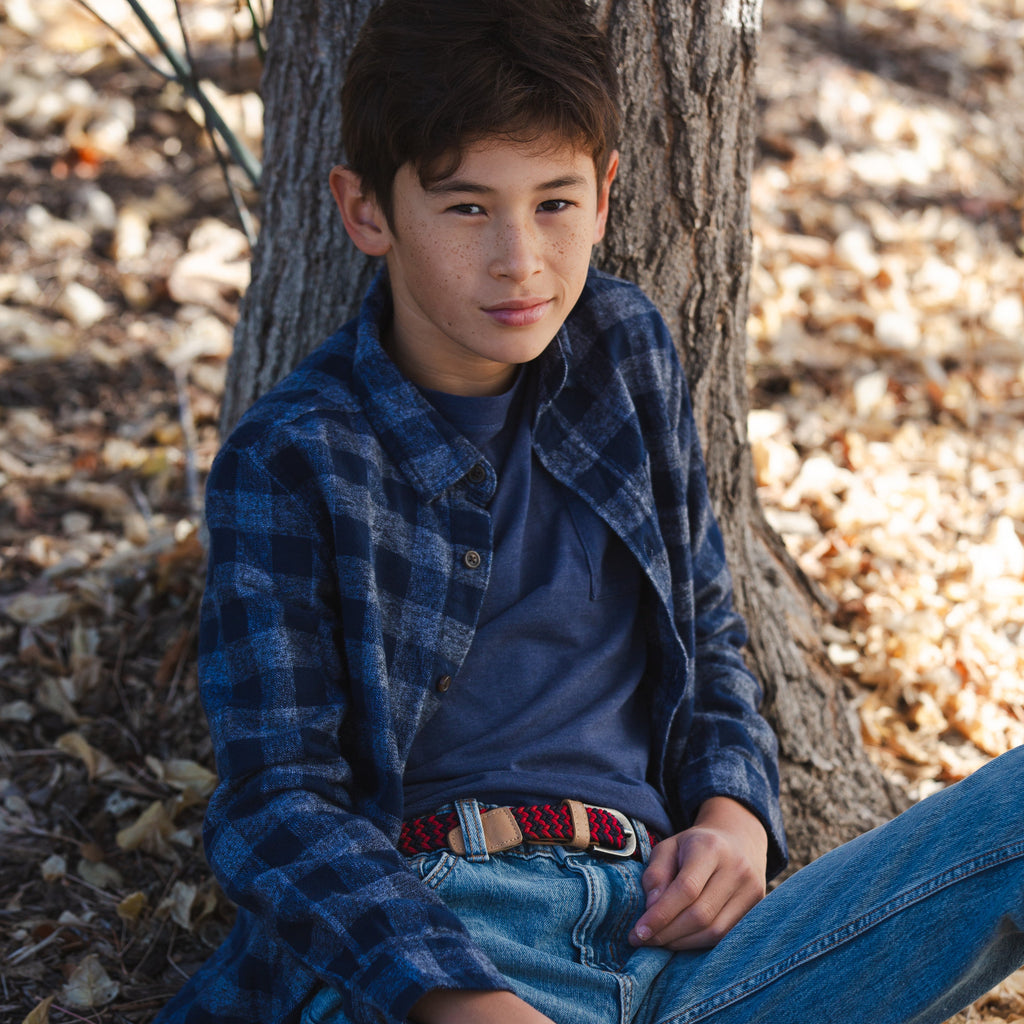 Kids woven belt on jeans, dark blue and red braid with tan leather buckle strap