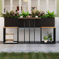 Black woven rattan patio furniture set with raised garden bed and slatted table top