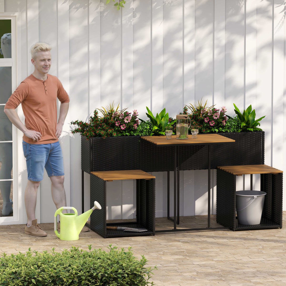 Outdoor patio set with raised planter, black rattan benches, and wood slatted tabletop