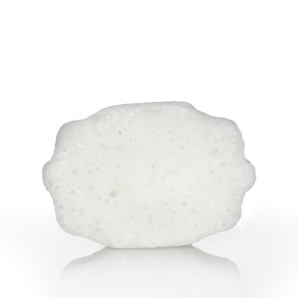 White textured sponge buffer pad, oval flower-like shape