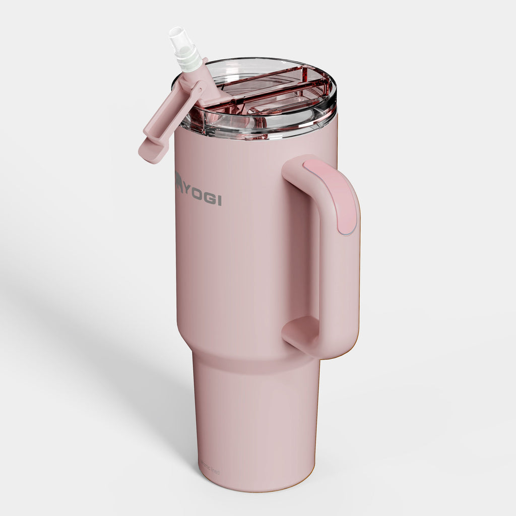 Ceramic-lined tumbler in light pink with flip-open clear lid and straw