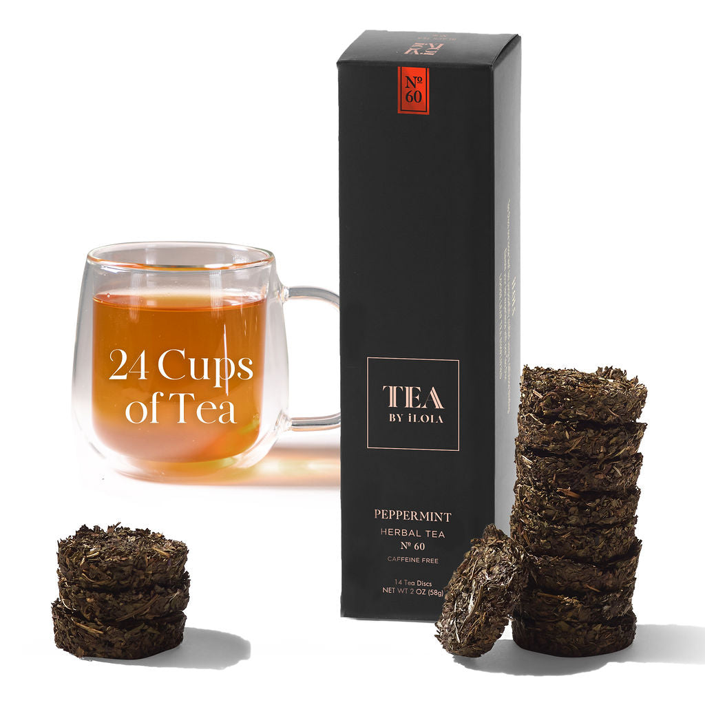 Peppermint tea box with tea discs and a glass cup of brewed tea