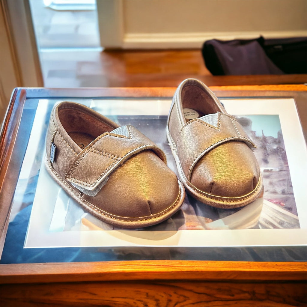 Gold metallic slip-on barefoot shoe topper pair with two adjustable straps