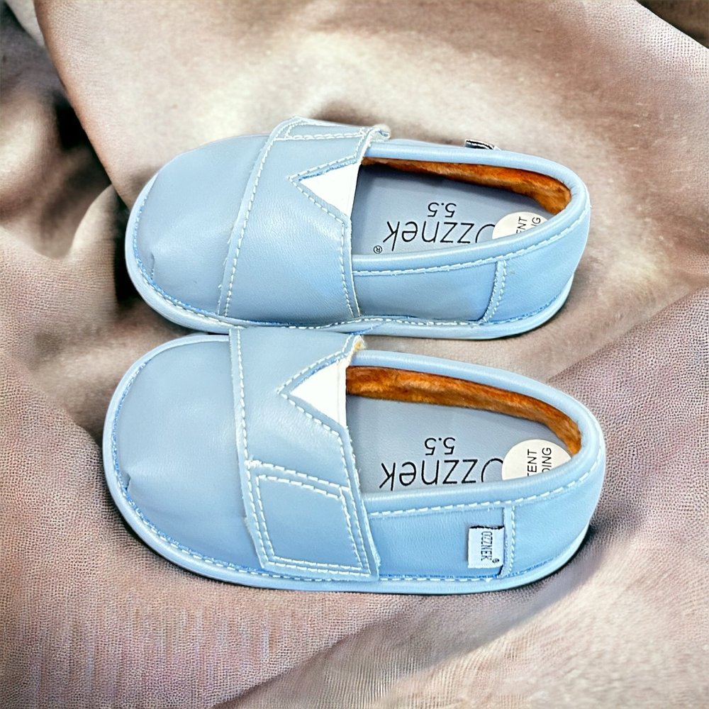 Light blue slip-on barefoot shoes with elastic gore and cushioned insole, pair view