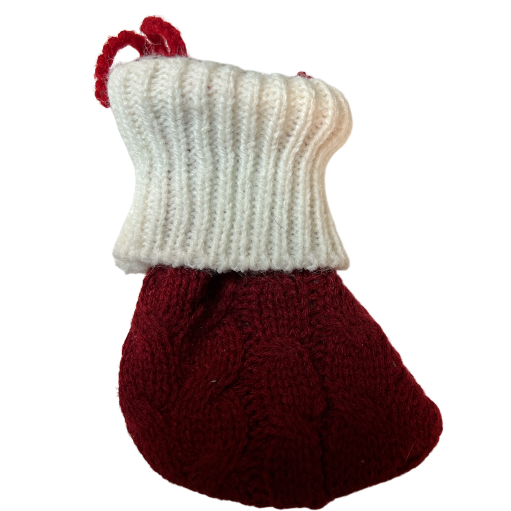 Knitted red-and-white stocking ornament with white cuff and dark red body