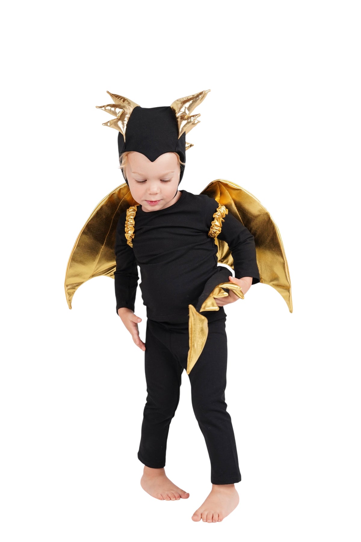 Black dragon costume with gold wing cape and spiked horn headpiece on child
