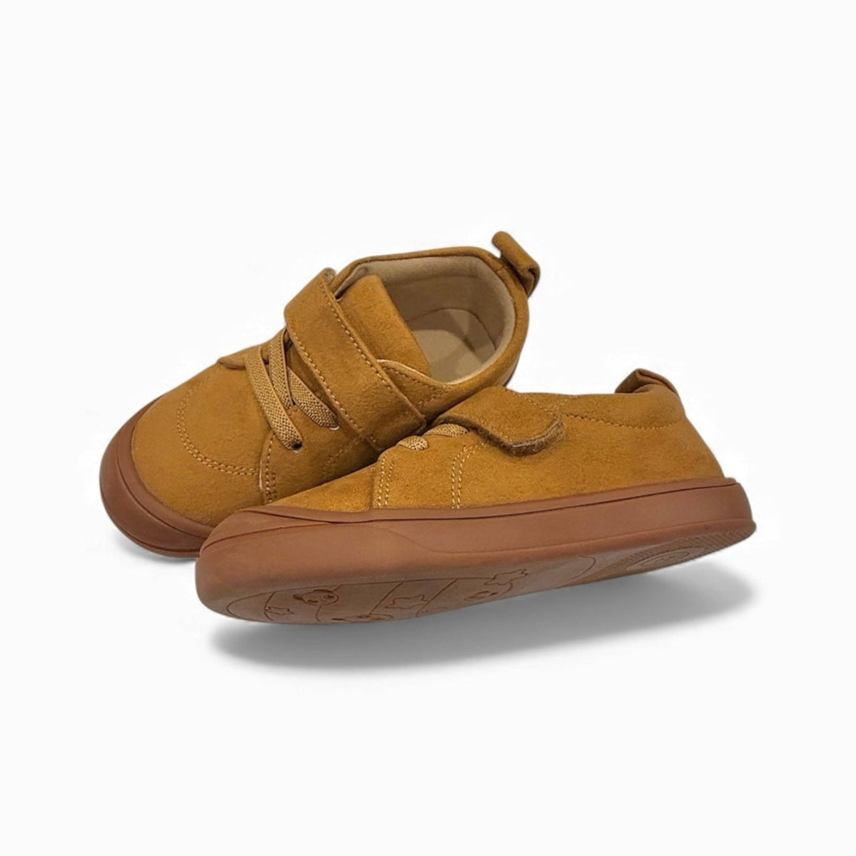 Kids' tan barefoot sneakers, close-up angle showing strap and laces