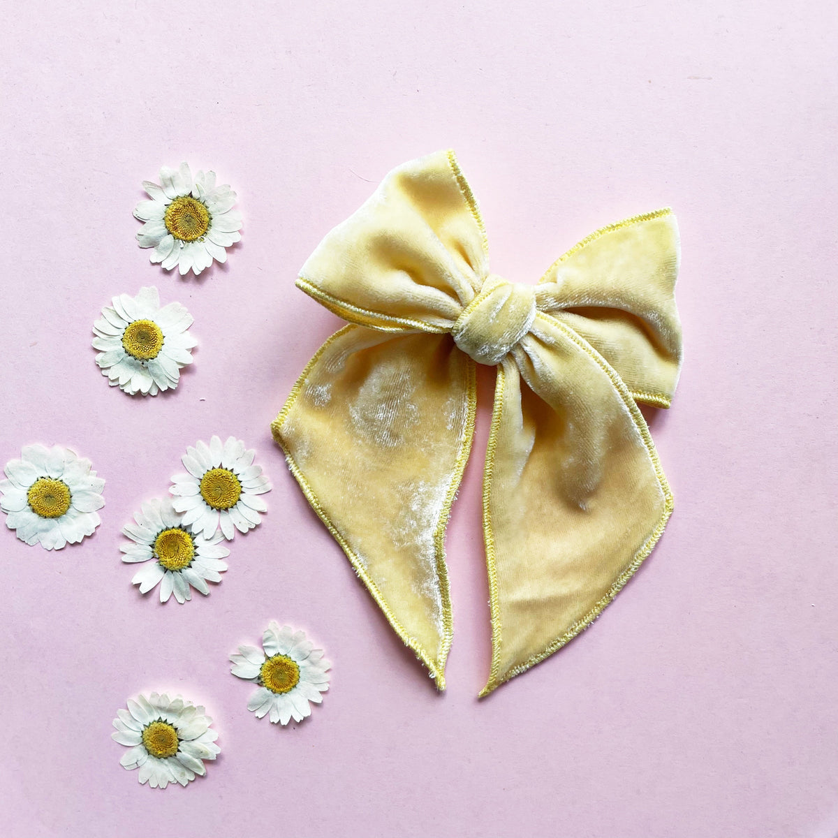 Butter yellow velvet bow with wide loops and center knot