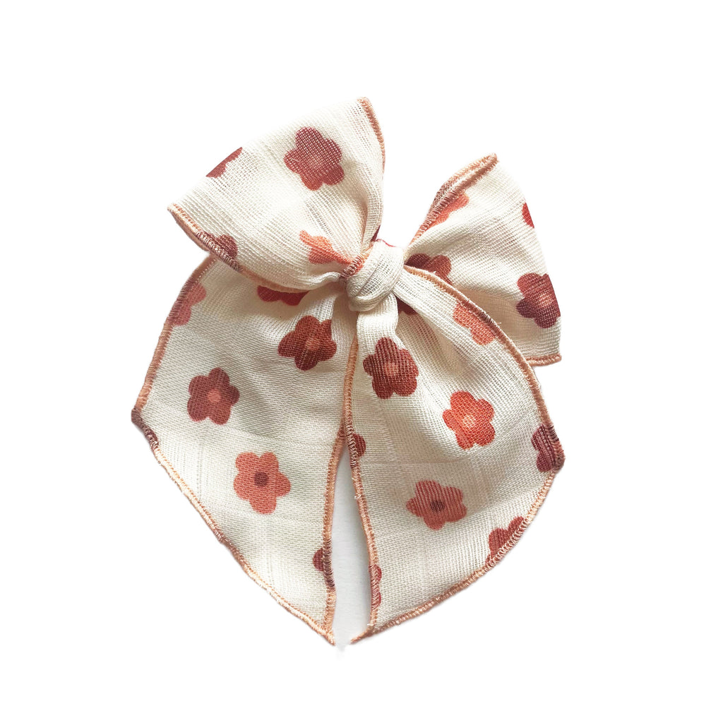 Cream gauze Elle bow with red clover daisy print, full bow shape and tied center