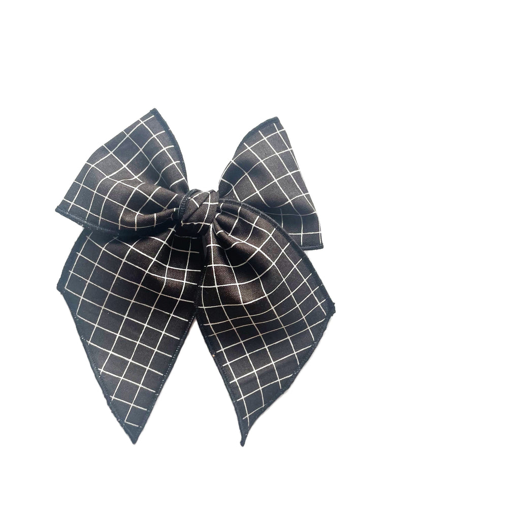 Dark grid fabric bow with layered loops and pointed ends