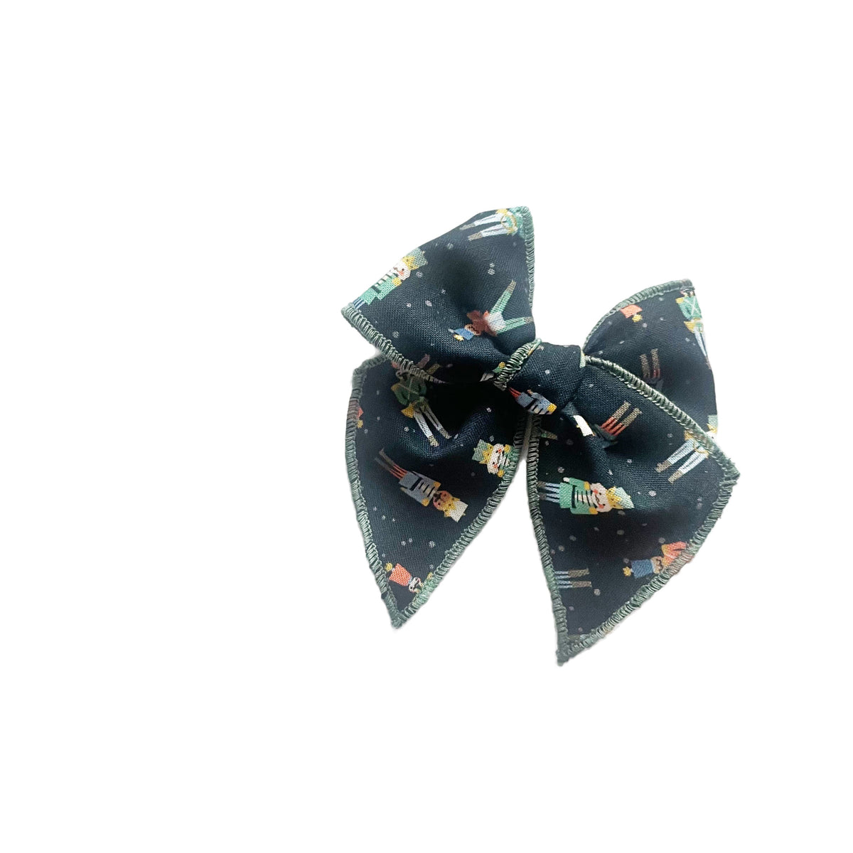 Navy nutcracker print hair bow with bow loops and short knot at center