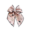 Pink Halloween bow with black edge trim, featuring ghosts and bats print