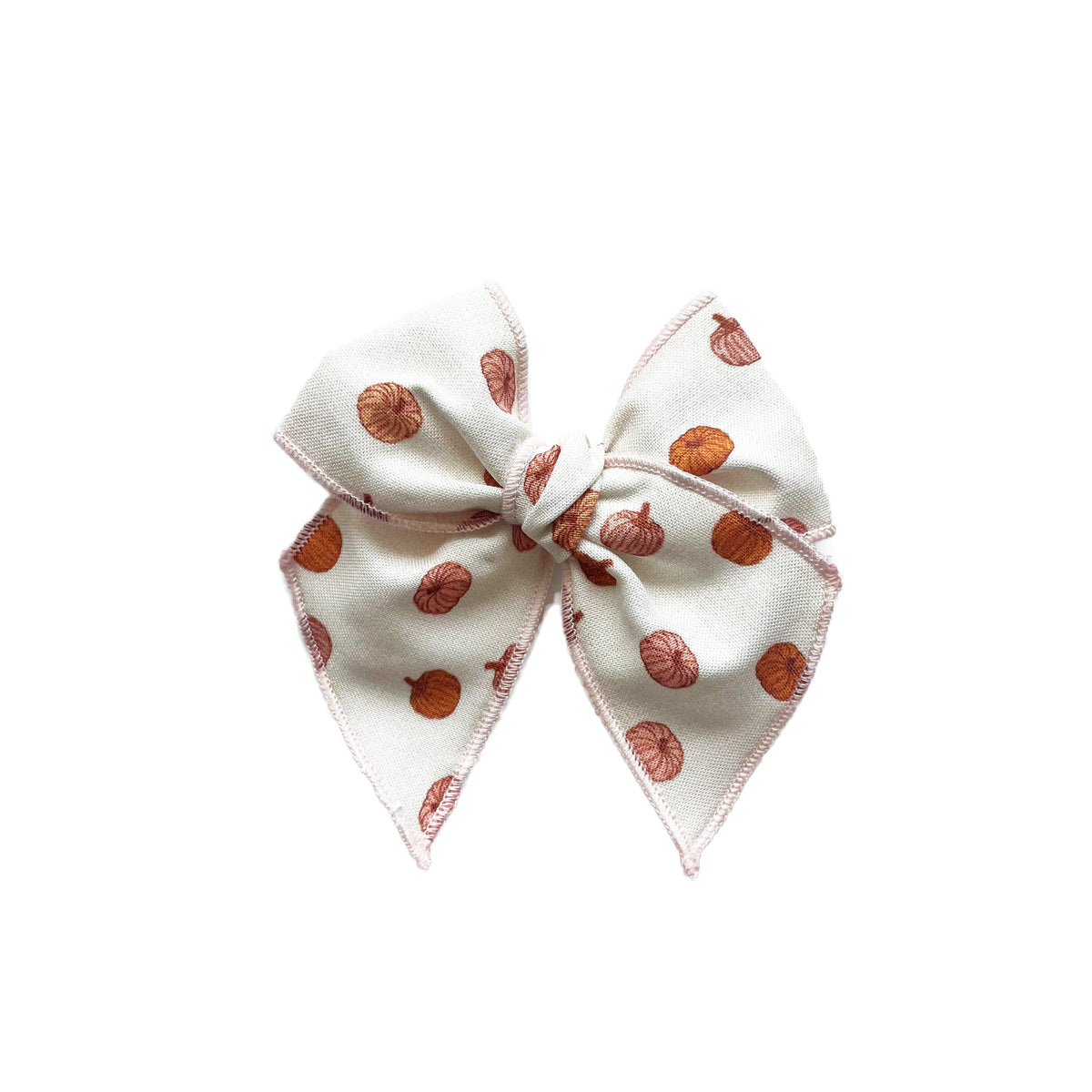 Cream pumpkin-pattern bow with pointed ends and centered tie detail